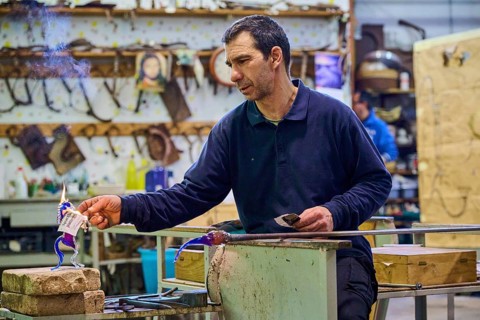 Glassblower at work in Murano, Italy, Europe