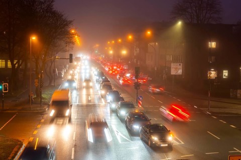 Dense fog, with visibility sometimes less than 100 metres, city centre traffic at rush hour on