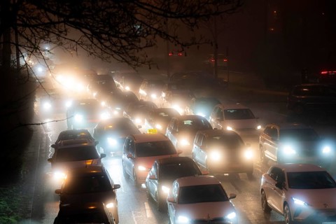Dense fog, with visibility sometimes less than 100 metres, city centre traffic during rush hour at