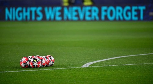 Adidas Football Pro 3rd match balls, lying on grass, behind them perimeter advertising NIGHTS WE