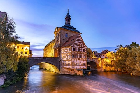 The Old Town Hall in the river Regnitz at dusk, Old Town of Bamberg, Upper Franconia, Bavaria,