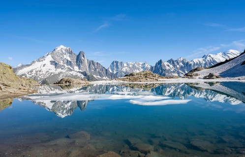 Mountain landscape with mountain lake, water reflection in Lac Blanc, mountain peak, Aiguille