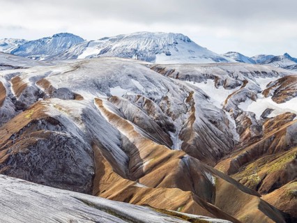 Early snow on the colorful rhyolite mountains, Landmannalaugar, Fjallabak Nature Reserve, Iceland,