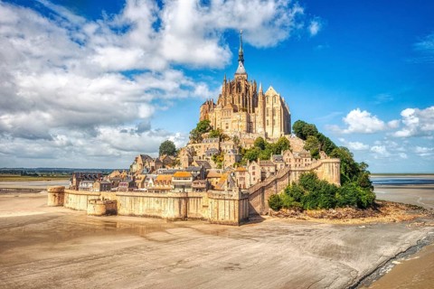 Impressive island with historic abbey, surrounded by sand and sky, Le Mont-Saint-Michel
