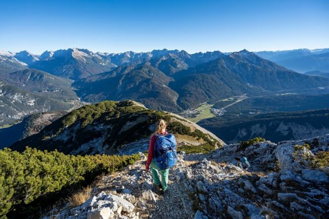 Mountaineer descending the summit of the Große Arnspitze, mountain panorama with Karwendel
