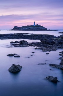 Godrevy Lighthouse, the lighthouse of Godrevy on Godrevy Island. In the evening at sunset. Long