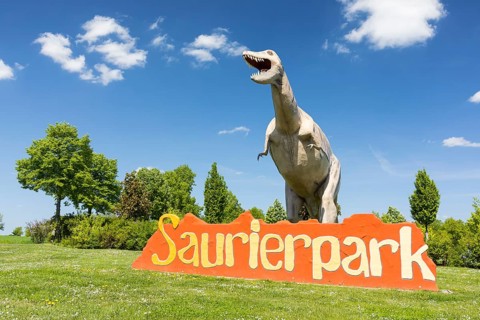Figure of a dinosaur at the entrance to the amusement park, Saurierpark Kleinwelka, Bautzen,