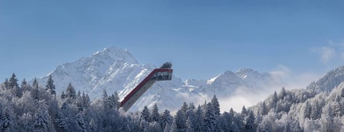 Mountain panorama over the Freibergsee in winter, near Oberstdorf, behind the Heini-Klopfer ski