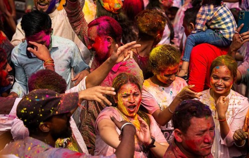 Revellers smear with Gulal or coloured powder and dance to play Holi, the Hindu spring festival of