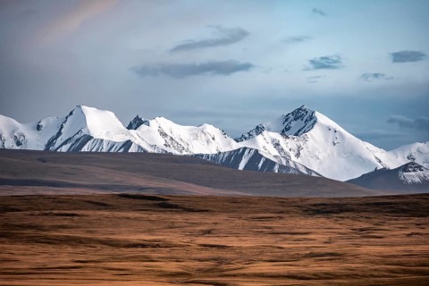 Glaciated and snow-capped mountains, dramatic landscape, high plateau, autumnal mountain landscape