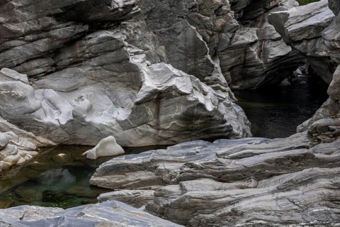 Rocks, granite rock formations in the Maggia River near Ponte Brolla, in the Maggia Valley, Valle
