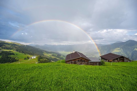 Alpine huts, view over the Brixen Valley with rainbow, Hochbrixen, Brixen im Thale, Kitzbühel Alps,