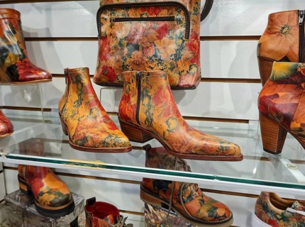 Photo of colourful ankle boots and handbags with floral patterns, La Boca district, Buenos Aires,