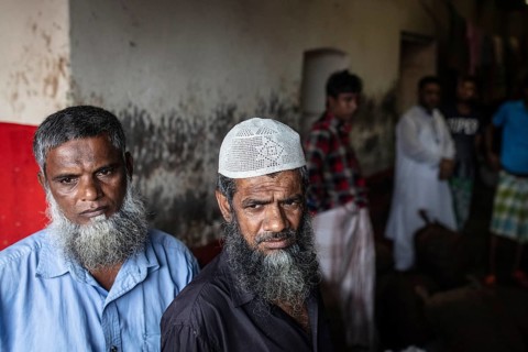 Traders in front of their shop at Sadarghat, river quay at Buriganga, Dhaka, Bangladesh, Asia