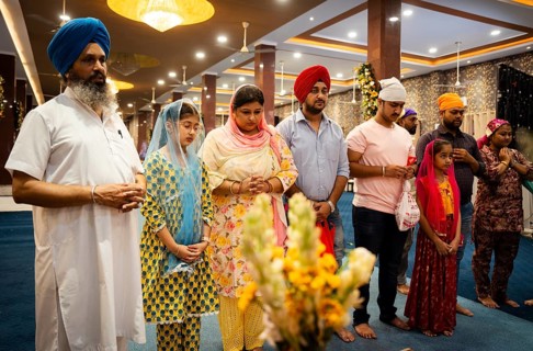 Sikh devotees offer prayers at a Gurudwara on the occasion of Guru Nanak Jayanti, in Guwahati,