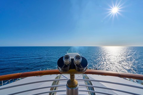View from the ship's deck, Mein Schiff 6, under bright sunshine and blue sky, binoculars installed