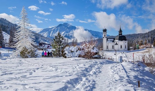 Seekirchl with artificial winter fir tree and Hocheder 2797m in winter, Seefeld, Seefeld Plateau,