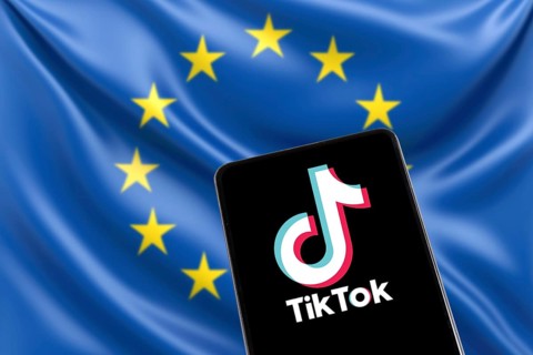 TikTok logo from China with EU European Union flag social media on a mobile phone in Stuttgart,