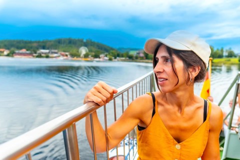 A female tourist on a boat on Lake Titisee in the Black Forest, Germany, Europe