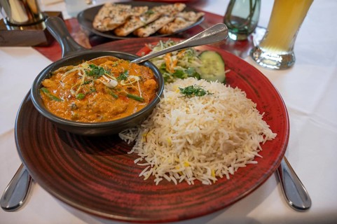 Mango Chicken, chicken in fresh mango-saffron cashew nut almond sauce and served with rice in an