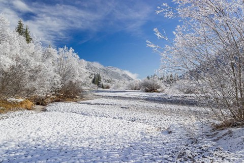 Isar valley in winter at temperatures of minus 18 degrees Celsius. Snow covered landscape with the