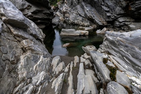 Rocks, granite rock formations in the Maggia River near Ponte Brolla, in the Maggia Valley, Valle