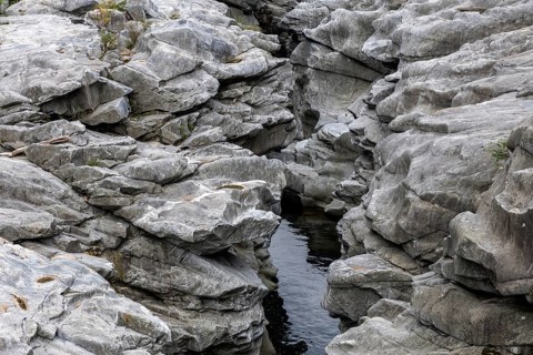 Rocks, granite rock formations in the Maggia River near Ponte Brolla, in the Maggia Valley, Valle