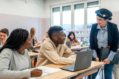 Multi ethnic students listening to their teacher during a lesson in a classroom at the university