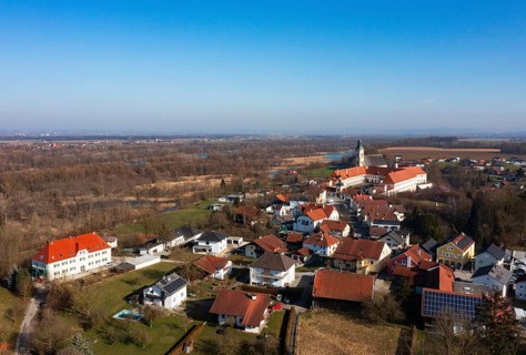 Drone shot, view of the village with Augustinian monastery Reichersberg, Reichersberg, Innviertel.