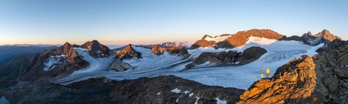 Panorama, atmospheric sunrise in a picturesque mountain landscape, alpenglow, aerial view,