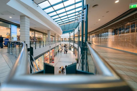 Elongated aisle in a modern shopping centre under a glass roof, Sterncenter Sindelfingen, Böblingen