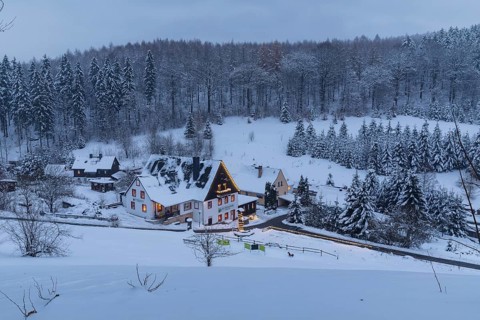 Pension Oberlochmühle with Christmas lights in the snow, Oberlochmühle, Deutschneudorf, Erzgebirge,