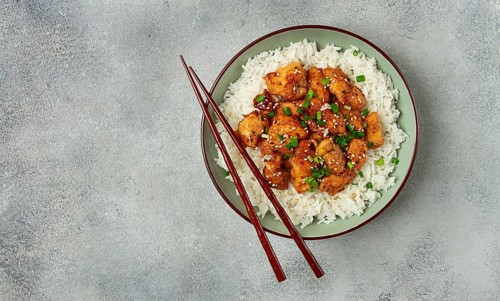 Fried chicken teriyaki with rice, green onion and sesame, homemade, no people