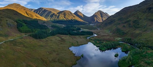 Mountains reflected in lake, morning light, sunny, autumn, aerial view, panorama, Lochan Urr, Glen