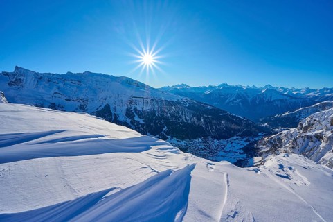 Snowy mountain landscape under a clear blue sky with bright sunshine, Gemmi Pass, Leukerbad, Leuk,