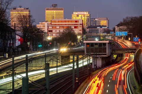 Motorway A40, Ruhr expressway, heavy traffic jam, rush hour, city passage in Essen, skyline of the
