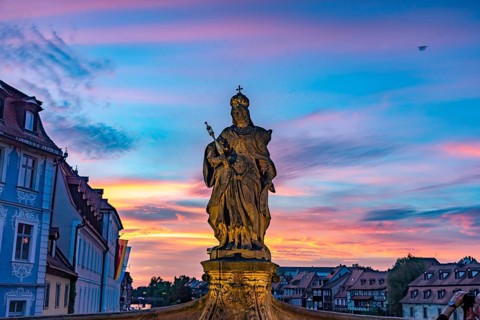 Statue of Empress Cunegonde on the Lower Bridge in Bamberg at sunset, Upper Franconia, Bavaria,