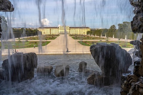 View through the Neptune Fountain to Schönbrunn Park and Palace, UNESCO World Heritage Site in