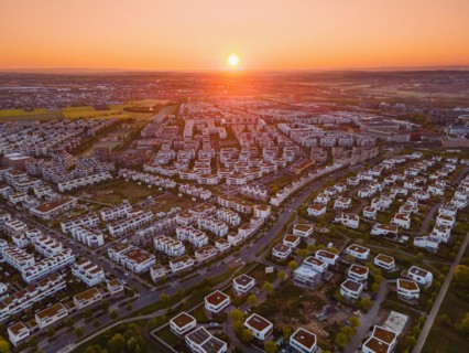 The sun rises over the Riedberg district of Frankfurt. (Aerial view with a drone), Riedberg,