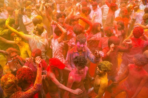 Revellers smear with Gulal or coloured powder and dance to play Holi, the Hindu spring festival of