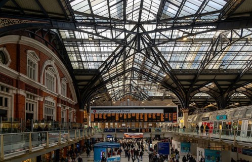 Details roof engineering at Liverpool Street railway station, London, England, UK Concourse busy