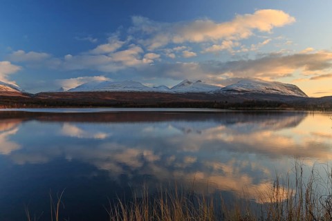 Mountains reflected in lake, autumn colours, sunny, evening light, Lapporten, Abisko National Park,
