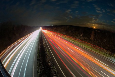 A7 Motorway, Autobahn, beside Kassel at night with light trails from the traffic headlights and