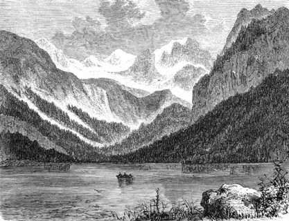 Rowing boat on Lake Gosau in a snow-covered mountain landscape, narrow valley, forest landscape,
