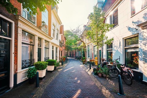 Street with old houses and parked bicycles in Haarlem, Netherlands