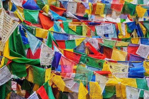 Tibetan Buddhism prayer flags (lungta) with Om Mani Padme Hum Buddhist mantra prayer. Leh, Ladakh,
