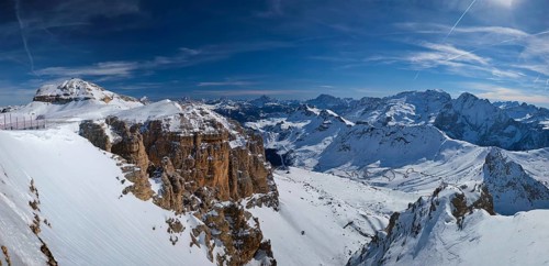 Panorama of a ski resort piste and Dolomites mountains in Italy from Passo Pordoi pass. Arabba,