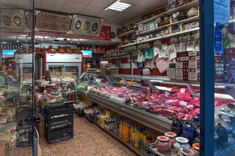 Grocery shop with meat counter in the historic centre, Genoa, Italy, Europe