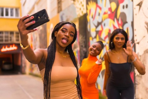 San Sebastián, Gipuzkoa Spain, February 2021: Three girls taking a selfie. Fashionable urban style