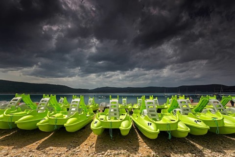 Pedal boats on the beach in Sainte Croix du Verdon, Lac de Sainte-Croix, thunderstorm atmosphere,